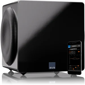 A sleek SVS subwoofer with a smartphone displaying its app for customizable audio settings. Ideal for home theaters.