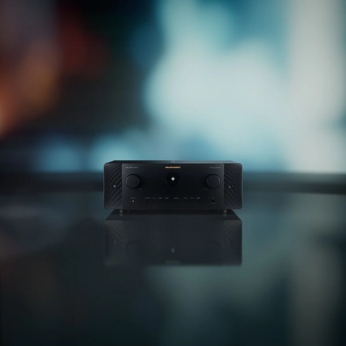 Marantz home theater amplifier showcased on a sleek surface, featuring a modern design and audio control options.
